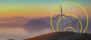 Foto di tre turbine eoliche su una collina con il contorno dell’immagine grafica Obiettivo emissioni nette zero