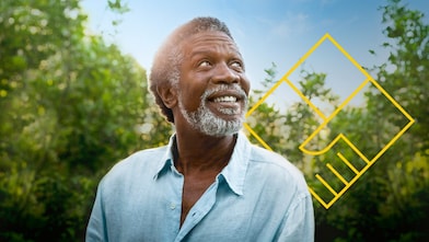 Uomo con la barba sorridente di fronte agli alberi con un contorno dell’immagine grafica Creare valore per gli azionisti
