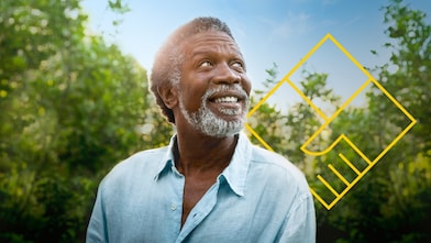 Uomo con la barba sorridente di fronte agli alberi con un contorno dell’immagine grafica Creare valore per gli azionisti