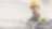 worker in a yellow hard hat transposed onto a background of a power plant