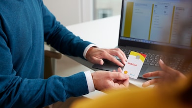 Hand holding euroShell card