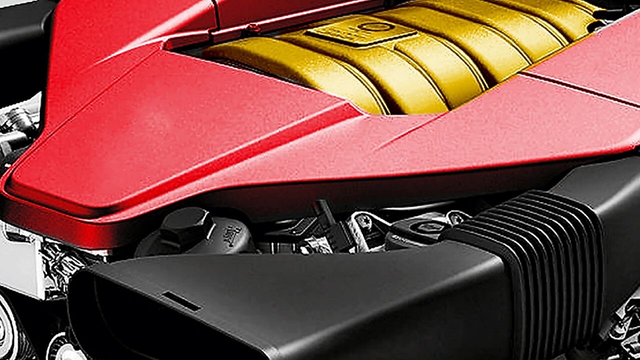 The engine of a car, with red trim and gold middle